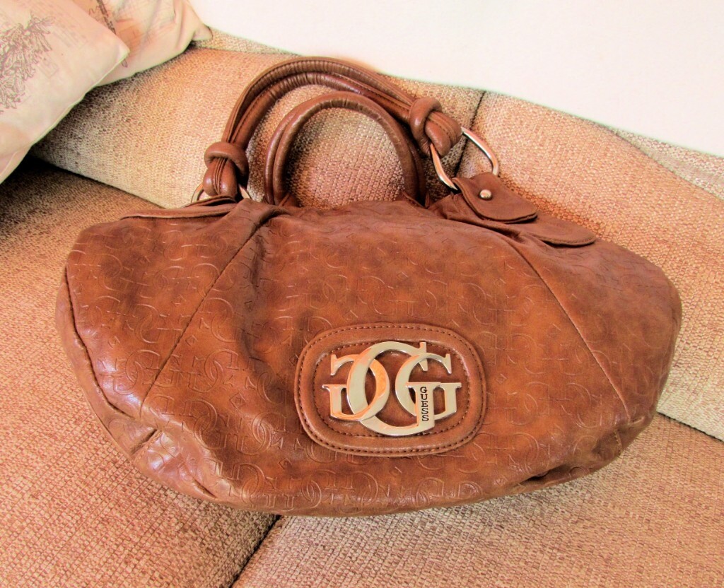 how much does a guess purse cost